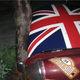 Illustration for article titled Olde English 800-Fueled Driver Obliterates Union Jack-Adorned MGB-GT, We Struggle To Find Meaning